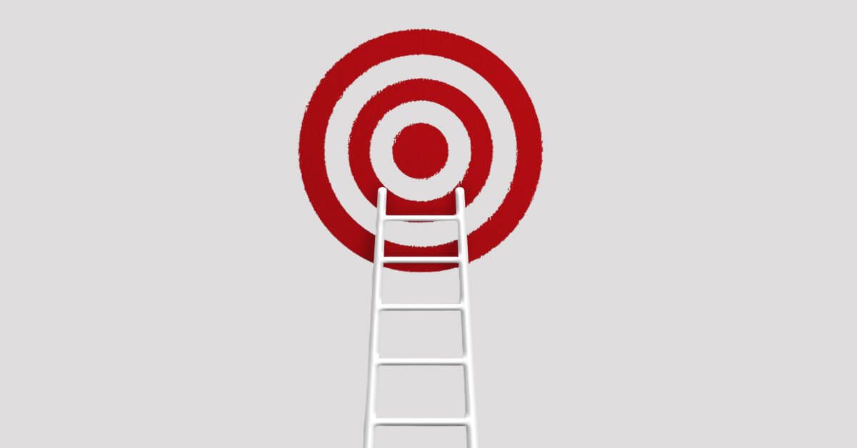 A ladder leading up to a red and white target board