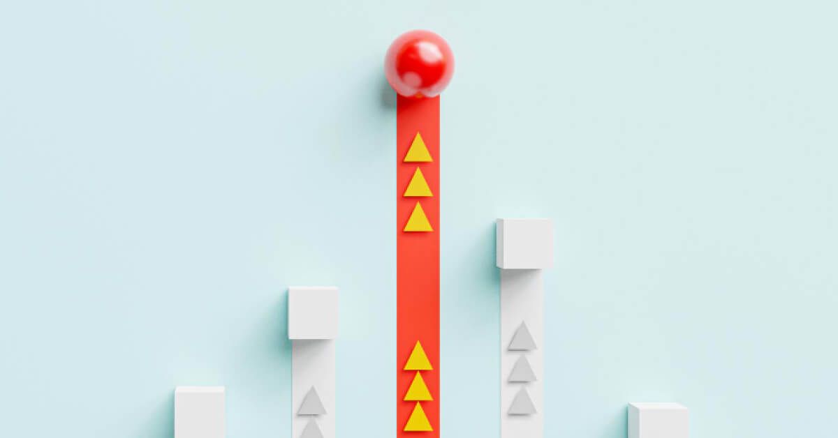 A red ball on top of red tape with yellow arrows