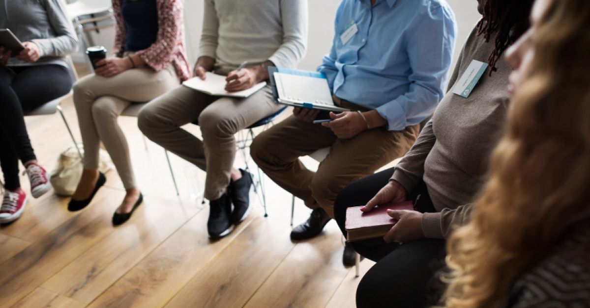 A group of employees sitting in a circle