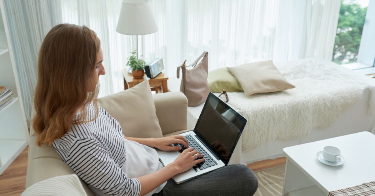 Employee working on a laptop at home