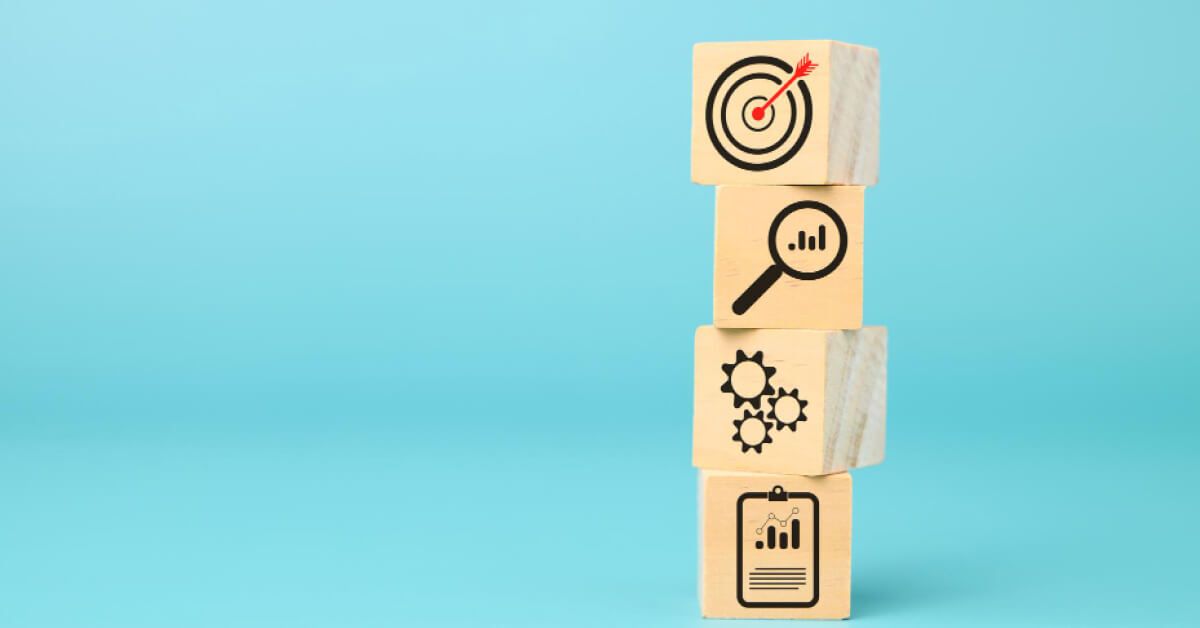 Wooden blocks with business icons