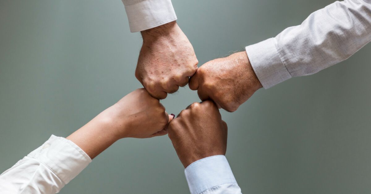 Employees participating in a group cheer