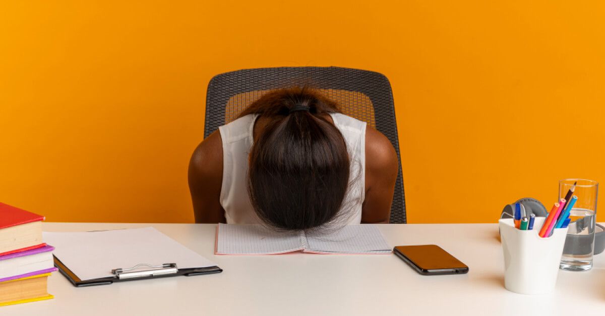 A girl lying down in table