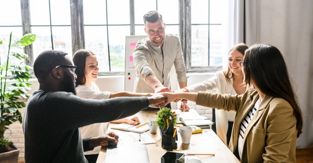 Employees participating in a group cheer