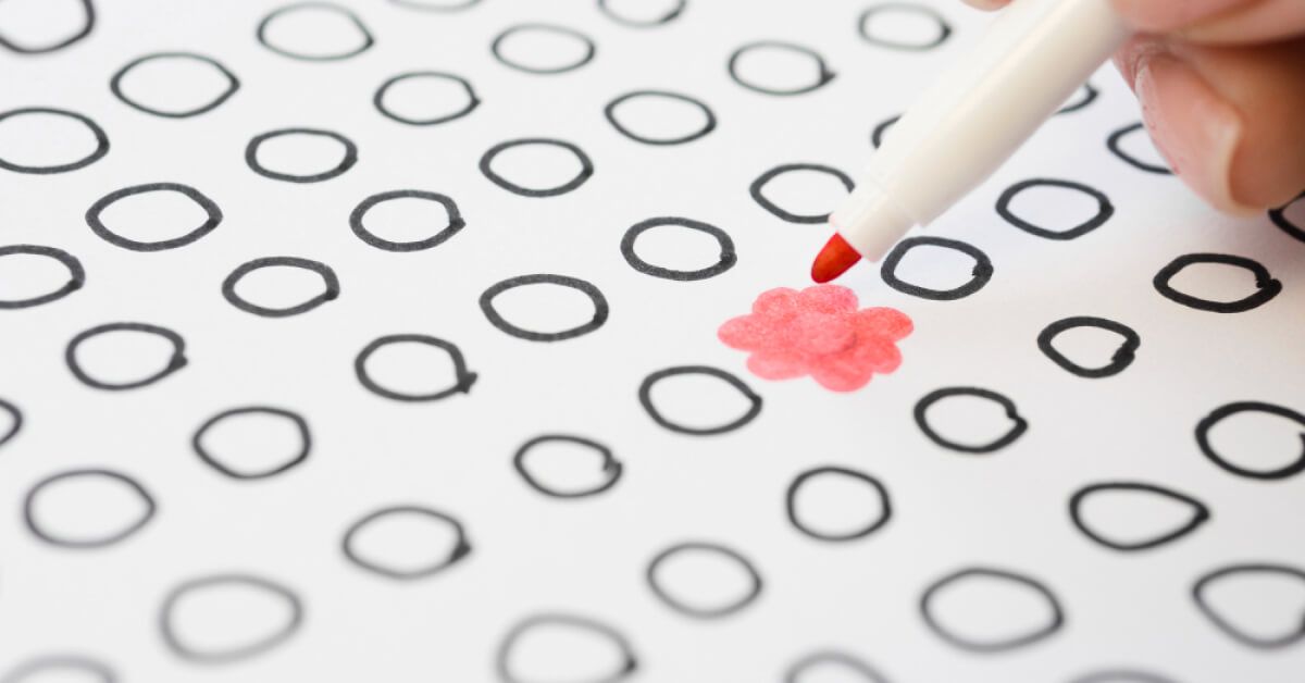 Usage of a red pen to illustrate a flower among other circles