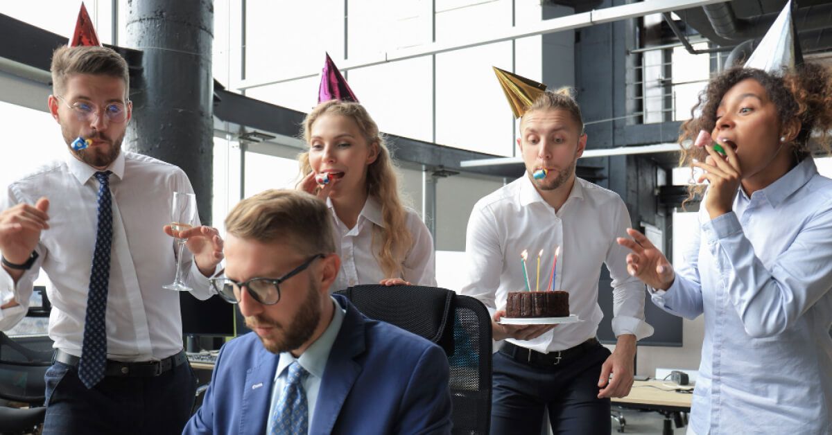 Employees are surprising another employee on their work anniversary 