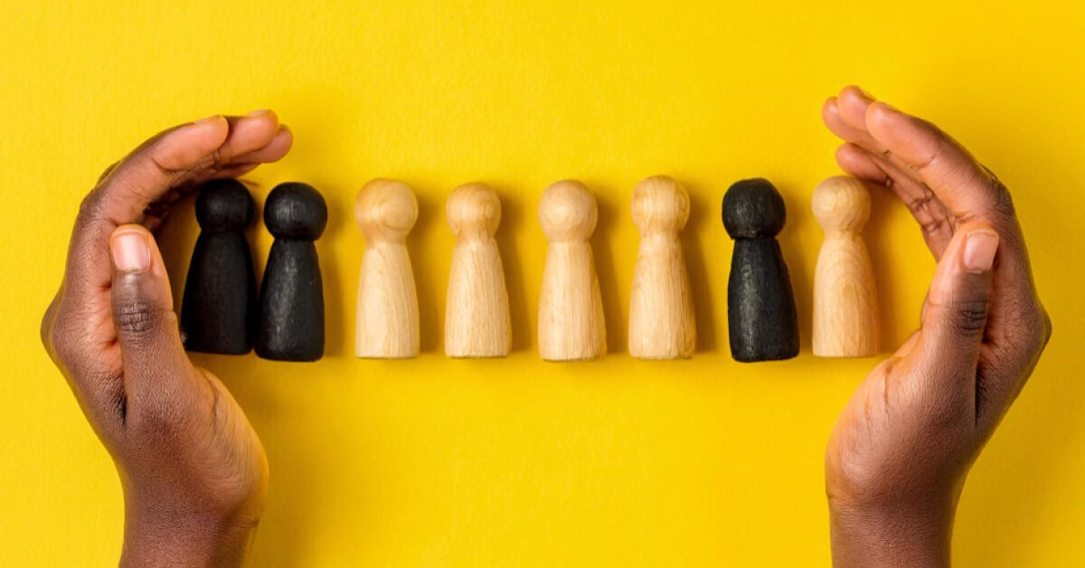 Hands holding wooden blocks in different colour