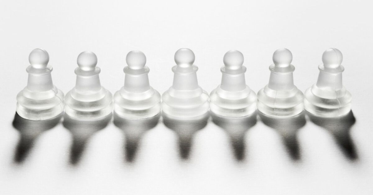 A set of seven white chess pieces