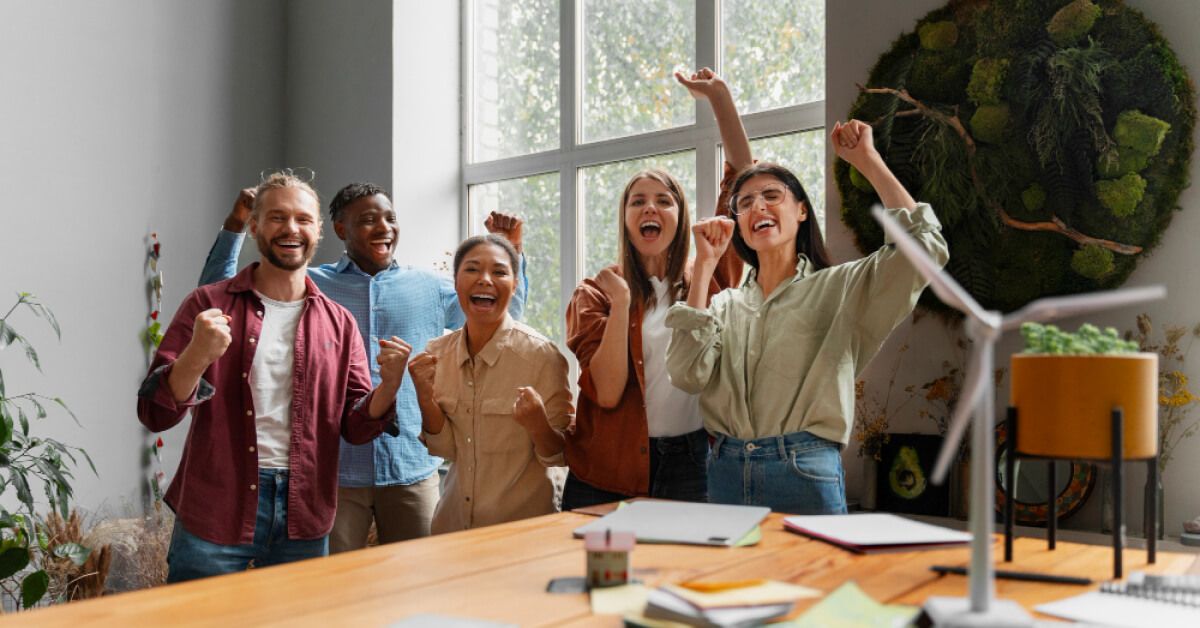 Employees participating in a group cheer