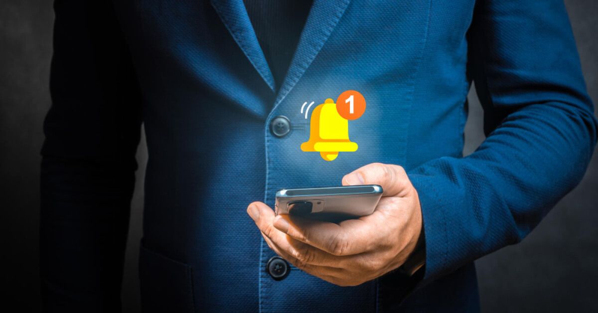 Employee checking phone where he got a notification 