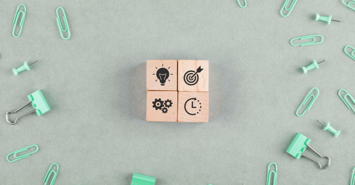 Wooden blocks with innovation and goals icons