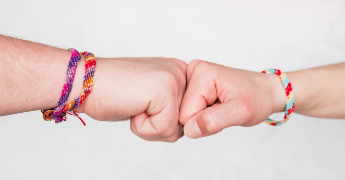 Two people participating in a fist bump