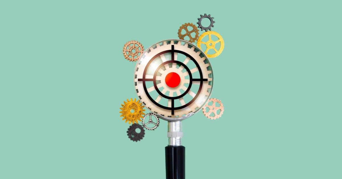 Magnifier glass overlooking a set of gears