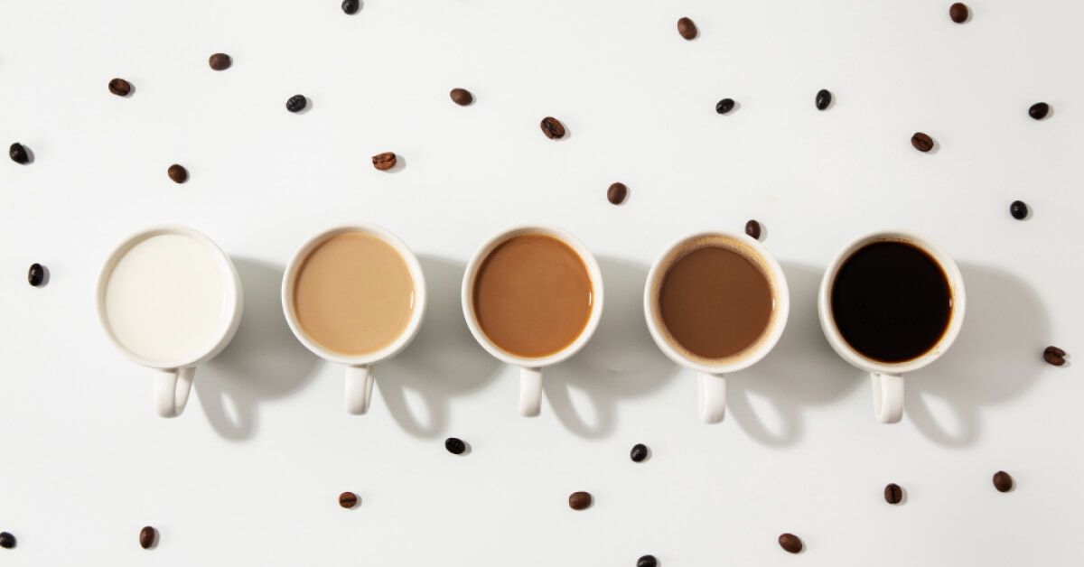 A series of cups with coffee in varied shades of brown