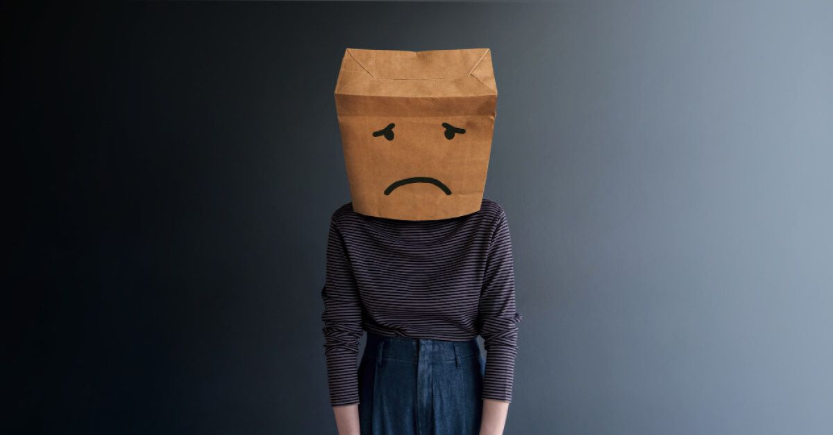 A man with a paper bag on his head