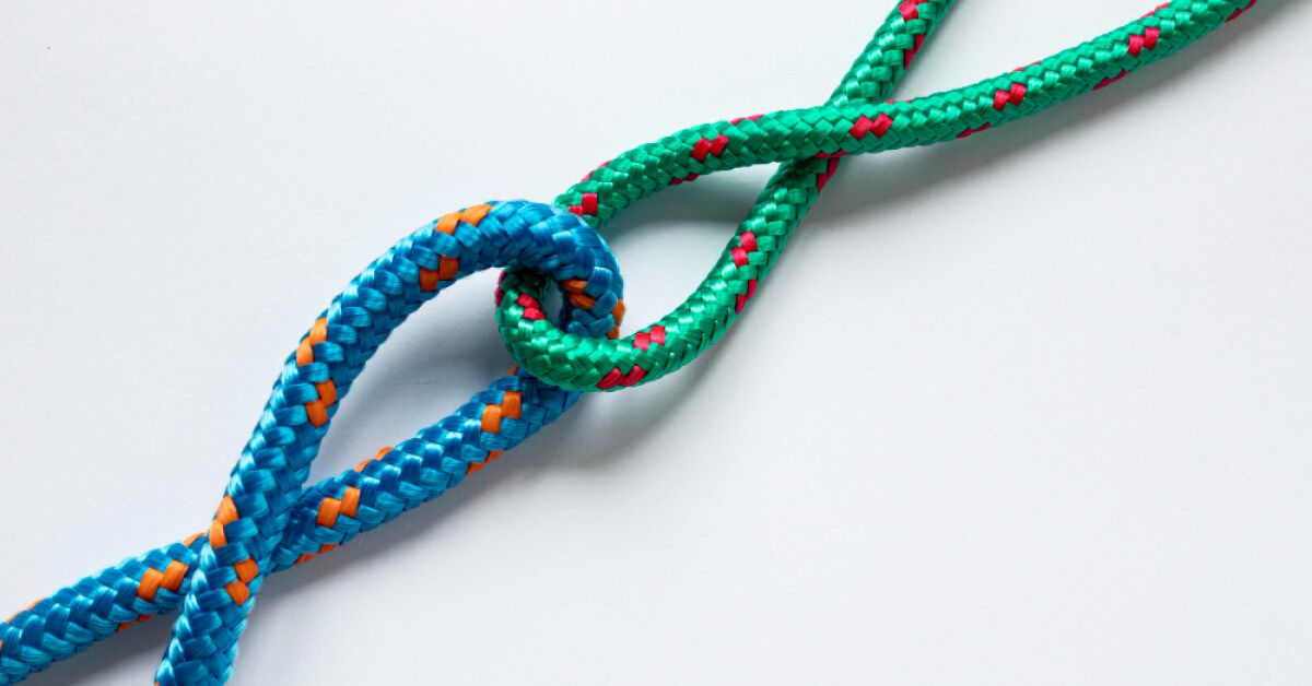 Green and blue strings that are looped together